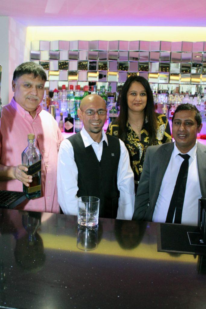 (from left) Dilbar owners Vijay and Pam Bassi (left and third left) with Aziz Khan (second left) and Dilbar manager Ahad 'Raj' Uddin (right).