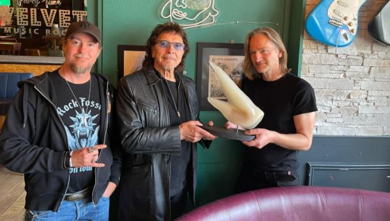 Rock legend Tony Iommi presented with old fossil named after him on Westside
