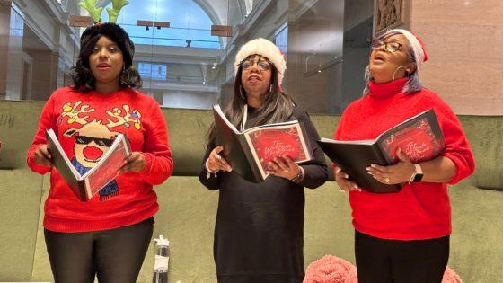 Westside Christmas Choir serenades staff and visitors at Baskerville House